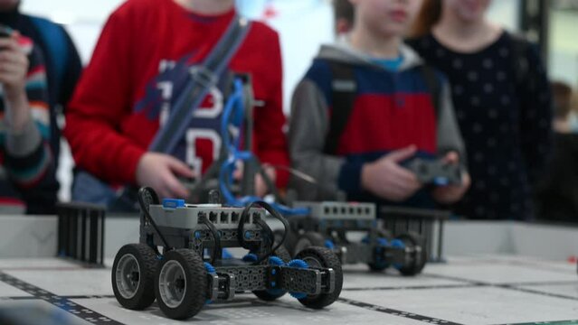 robot competitions, children control robots. High quality 