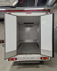 interior refrigerated truck is insulated and hygienically white for transporting goods and...