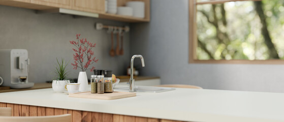 A close-up image of a modern, minimalist kitchen island or kitchen counter in a modern kitchen.