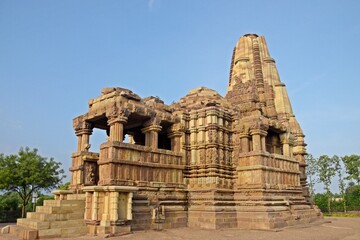 Beautiful temple adorned with sculptures and surrounded by peaceful nature., Duladeo Shiva Temple - Khajuraho - Madhya Pradesh - India
