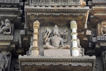 Elaborate and precise carvings in sculptures are intricate works of art created from a diverse range of materials, showcasing enchanting shapes and textures at khajuraho group of monuments, India