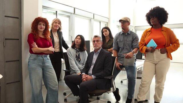 group of office workers listening to their interlocutor and asking questions