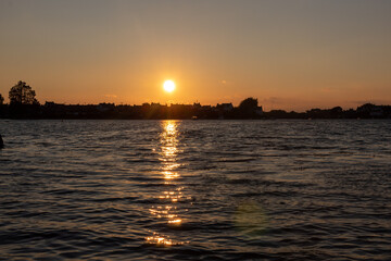 Naklejka premium sunset over the river