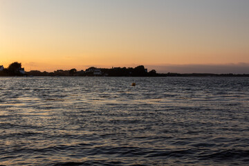 Naklejka premium sunset over the river