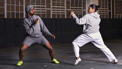Martial arts, fight and man with woman, fitness and wellness with cardio or exercise with energy....