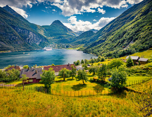Sunny summer view of Geiranger port with huge peak on background, western Norway, Europe. Stunning...