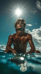 An attractive surfer sitting on his board, waiting for the waves as the sun sets, painting the sky with colors.