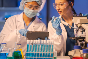 A female scientist conducts data analysis in a laboratory, research on medical equipment for...