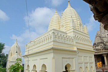 A serene Jain temple with intricate carvings and statues, radiating peace and spirituality. at...