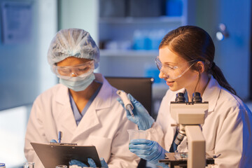 A female scientist conducts data analysis in a laboratory, research on medical equipment for...