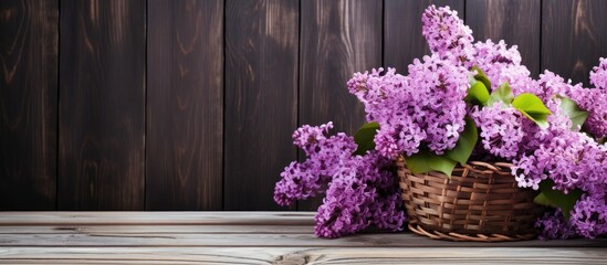 Fototapeta na wymiar Lilac flowers in a wooden basket