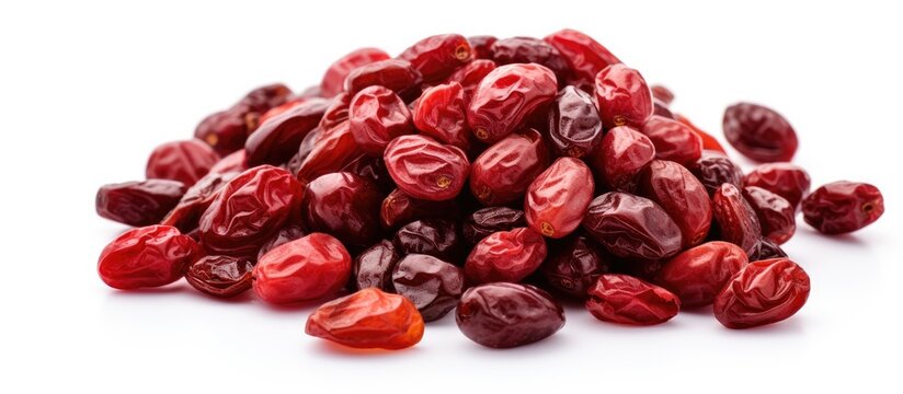 A pile of dried cranberries on a white background