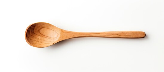 Wooden spoon on white surface - obrazy, fototapety, plakaty