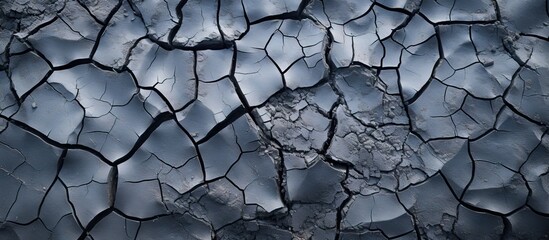 Cracked surface with sky in background