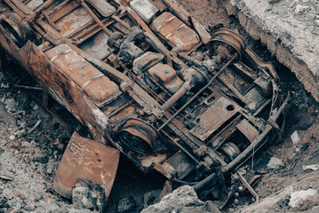 burnt cars and destroyed buildings of the workshop of the Azovstal plant in Mariupol