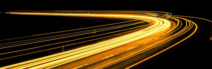 Cercles muraux Autoroute dans la nuit orange car lights at night. long exposure