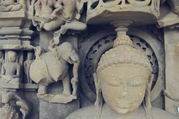 A finely detailed stone sculpture of a Jain Tirthankara ADINATH, with a serene expression,...
