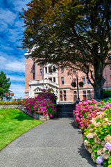 Fototapeta na wymiar Vancouver Island, Canada - August 15, 2017: City buildings in Victoria on a sunny day