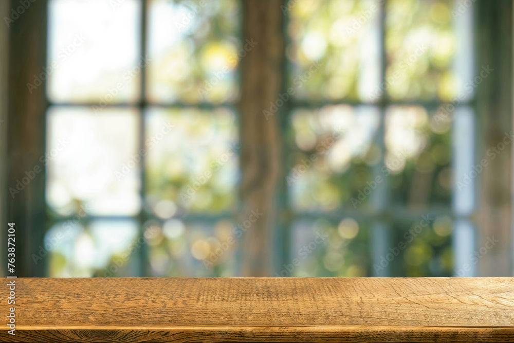 Poster Wooden table with bokeh lights and window background. Interior design template with copy space. High quality photo