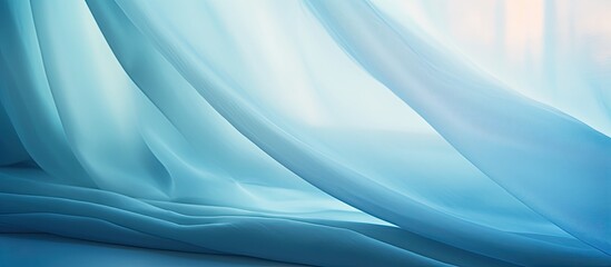 A detailed view of a vibrant blue curtain as light filters through, creating a soft glow