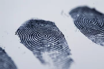 Fotobehang Close up of fingerprints on white paper background © Firn