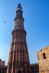 Fototapeta na wymiar The Qutub Minar at Delhi India. The height of Qutub Minar is 72.5 meters, making it the tallest minaret in the world built of bricks.