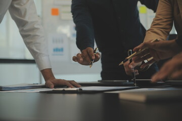 Business team collaboration discussing working analyzing with financial data and marketing growth report graph in team, presentation and brainstorming to strategy planning making profit of company.