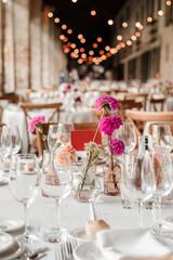 Table set up of wedding meal with flowers.