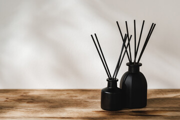 Minimalist Aromatic Reed Diffusers on a Wooden Surface Against a Soft Background - obrazy, fototapety, plakaty