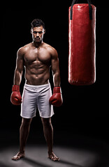 Fototapeta na wymiar Serious, boxer and portrait of man in black background with gloves for training with strength and muscle. Adult, athlete and male person in studio, healthy and power with body, punching bag and sport