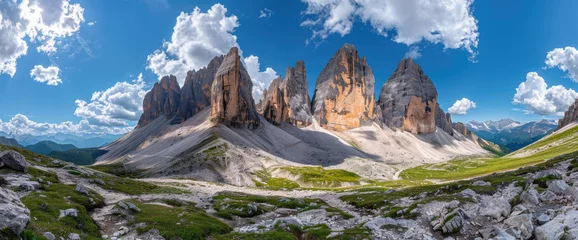 Fotobehang Photo of the Dolomites in Italy, panorama of three peaks with sharp mountain top rocks © Kien
