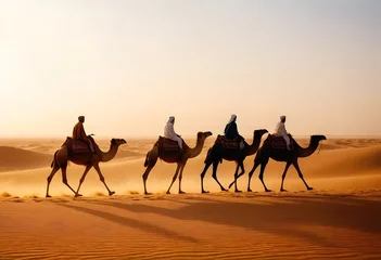 Fototapeten A caravan of camels led by a person in desert  © Uzzi1001