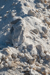 Mountains or piles of untreated salt.Salt industry. Salt flower. Industrial exploitation of salt growing in the pools of seawater between the marshes on the Atlantic coast.