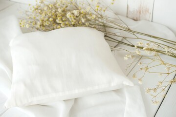 Fototapeta na wymiar White cotton and linen pillows Mockup with Boho Floral Accents