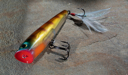 Topwater fishing lure with white tail