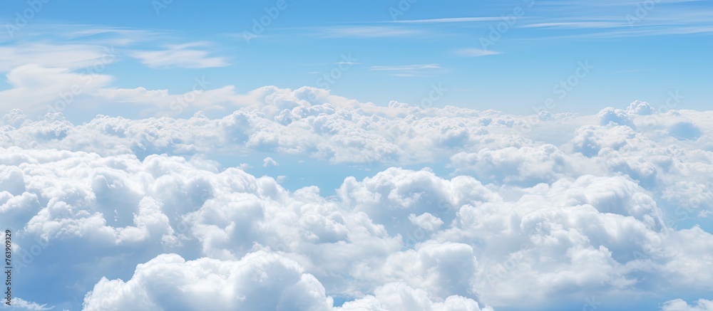 Wall mural the image features a sky filled with numerous clouds floating above the earth's surface