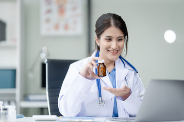 Portrait of mix race asian middle age female doctor in white lab coat and stethoscope while consult...