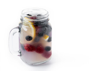 Fresh berry drink with blueberries and raspberries and lemon isolated on white background. Copy space