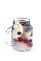 Fresh berry drink with blueberries and raspberries and lemon isolated on white background