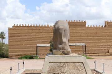 Several perspectives of the Lion of Babylon statue in the ancient city of Babylon on a cloudy day