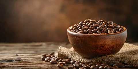 Tuinposter Aromatic freshly roasted coffee beans in a rustic wooden bowl,evoking the rich scent and cozy atmosphere of a neighborhood cafe © Bussakon