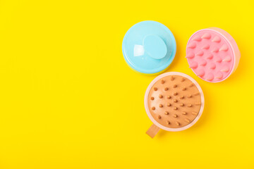 Brush for scalp massage on background. Brush for hair growth stimulating brush. Hair massage. stimulating brush. Hair care, head relaxation concept. Copy space.