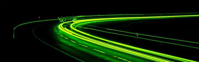 green car lights at night. long exposure