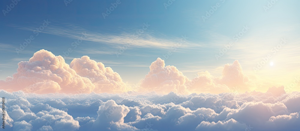 Wall mural the image features a scenic view of the sky filled with fluffy clouds and the sun shining brightly