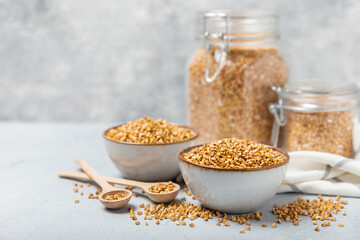 Green buckwheatin  on a wooden kitchen table.Superfood.Raw buckwheat porridge.Healthy vegan food concept, eco products, diet. Copy space.Organic food.weight loss and proper nutrition.