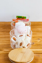 three-level glass storage container with snacks