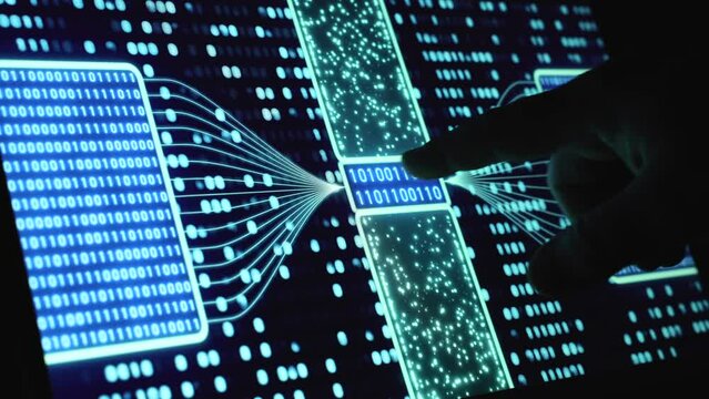 Digital screen with blue binary code. Finger points to data on a computer screen.  Bit, byte, algorithm, script, program, software, dual, coding, system configuration, sequence, illuminated numbers.