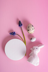 Empty podium or platform and white rabbit with eggs symbol for Easter on pink background