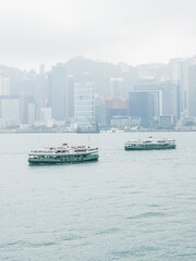 Ferry sailing across the Victoria Harbour, Hong Kong, in a misty day