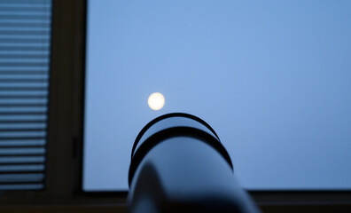 Telescope refractor pointed to the moon.
